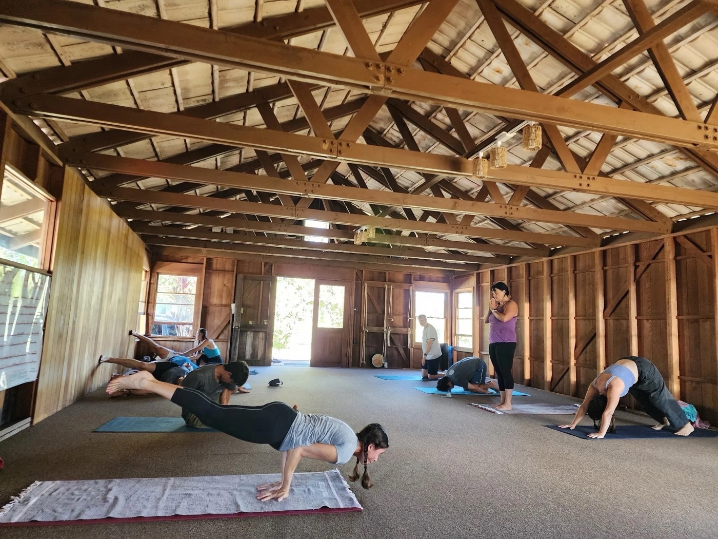 Practitioners in led class in the wooden Haiku shala